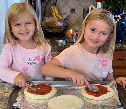 Girls making pizza
